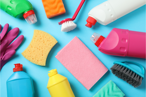 Cleaning supplies displayed on a blue background provided by housekeeping agencies